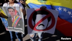 Venezuelans living in Honduras hold a protest against Venezuelan President Nicolas Maduro's government in Tegucigalpa, Honduras, Jan. 23, 2019.