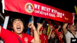 Supporters of Myanmar's National League for Democracy party cheer as election results are posted outside the NLD headquarters in Yangon, Myanmar, Nov. 9, 2015. 