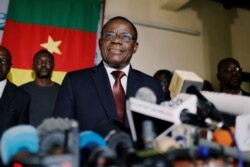 FILE - Maurice Kamto, then-presidential candidate of Renaissance Movement (MRC), holds a news conference at his headquarter in Yaounde, Cameroon, Oct. 8, 2018.