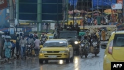 Armed Forces of the Democratic Republic of the Congo (FARDC) soldiers are seen sitting on top of a truck driving in the streets of Bukavu on Feb. 14, 2025. 