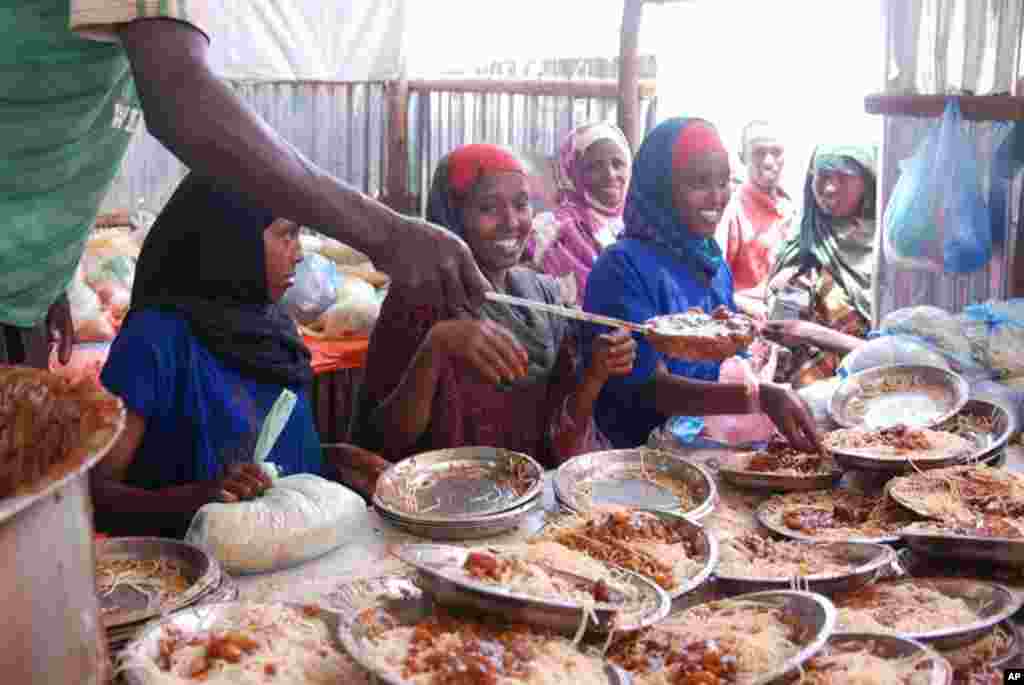 The feeding center offers two hot meals a day, in this case spaghetti with a meat sauce. VOA - P. Heinlein
