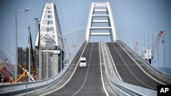 A view of the new bridge linking Russia and the Crimean peninsula prior to its opening ceremony near Kerch, Crimea, Tuesday, May 15, 2018. (Alexander Nemenov/Pool Photo via AP)