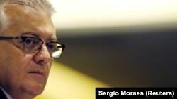 FILE - Aldemir Bendine, the former chief executive of state-controlled oil firm Petroleo Brasileiro SA, listens to a question during a news conference in Rio de Janeiro, Brazil, Jan. 28, 2016. 