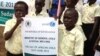 South Sudanese school children hold a poster during a march in Juba to mark the Day of the African Child.