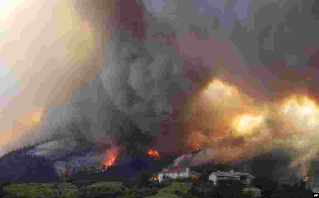 The Waldo Canyon wildfire burns as it moved into subdivisions and destroyed homes in Colorado Springs, Colorado, June 26, 2012.