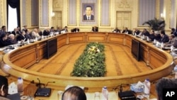 A general view of Egyptian Vice President Omar Suleiman, center back, meeting with leaders of Egyptian parties and the Muslim brotherhood leadership in Cairo, Egypt, Sunday, Feb. 6, 2011