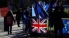 Pro and Anti Brexit protesters demonstrate outside the Houses of Parliament in London, Jan. 28, 2019.