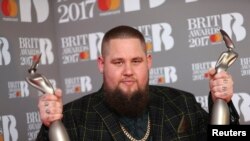Rory Graham lead singer of British band Rag'n'Bone poses with his award for Best British Breakthrough Act at the Brit Awards at the O2 Arena in London, Feb. 22, 2017.