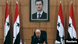 Syria's Foreign Minister Walid al-Moualem talks during a news conference in Damascus, Syria, Feb. 6, 2016. 