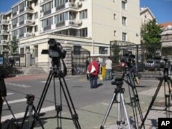 Plain clothes agents guard the front of the residential Beijing compound where Liu Xia lives. She is the wife of the newest Nobel Peace Laureate, jailed dissident Liu Xiaobo. She is reportedly inside, but under house arrest.