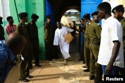 A prisoner leaves the national prison, after 259 prisoners from Darfur rebel movements were released according to the general amnesty decision of the President Omar al-Bashir, in Khartoum, Sudan, March 9, 2017