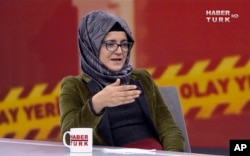 In this image from TV, Hatice Cengiz, who is Turkish, reacts during an interview on Turkish television channel HaberTurk, Oct. 26, 2018, about the day her fiance, Saudi journalist Jamal Khashoggi entered the Saudi Arabia Consulate on Oct. 2, and was killed inside.