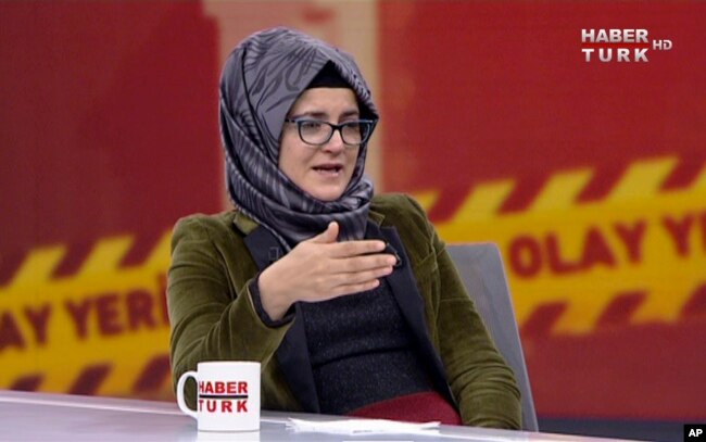In this image from TV, Hatice Cengiz, who is Turkish, reacts during an interview on Turkish television channel HaberTurk, Oct. 26, 2018, about the day her fiance, Saudi journalist Jamal Khashoggi entered the Saudi Arabia Consulate on Oct. 2, and was killed inside.