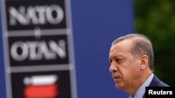 FILE - Turkey's President Tayyip Erdogan arrives for the NATO Summit in Warsaw, Poland July 9, 2016. 