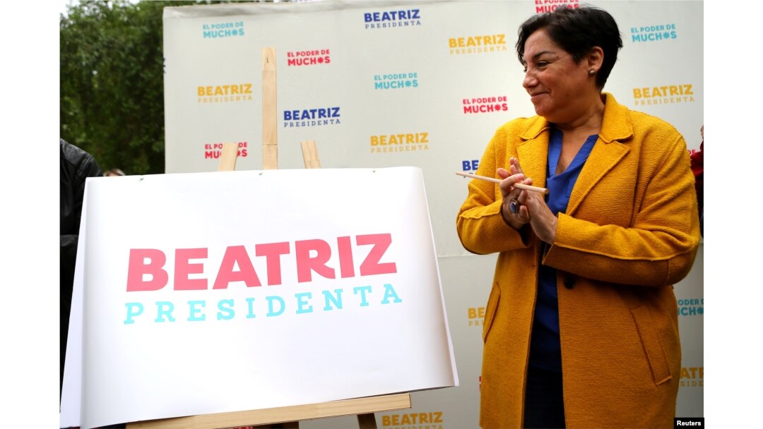 FILE - Chilean presidential candidate Beatriz Sanchez coalition takes part in a campaign rally in Santiago, Chile, Nov. 3, 2017.