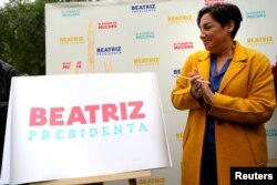 FILE - Chilean presidential candidate Beatriz Sanchez coalition takes part in a campaign rally in Santiago, Chile, Nov. 3, 2017.