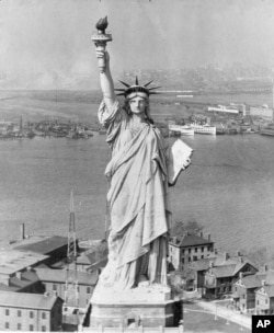 The Statue of Liberty in New York Harbor with New Jersey in the background, Oct. 12, 1933.