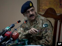 Pakistan's army spokesman Major-General Asim Bajwa briefs the media about a Taliban attack on a school in Peshawar, Pakistan, Dec. 16, 2014.