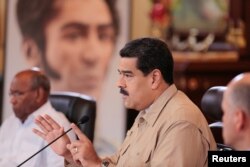 Venezuela's President Nicolas Maduro speaks during a meeting with ministers at Miraflores Palace in Caracas, Venezuela Dec. 1, 2016.