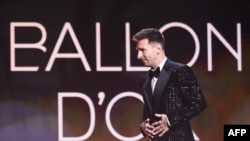 Paris Saint-Germain's Argentine forward Lionel Messi arrives to deliver a speech after being awarded the Ballon d'Or award during the 2021 Ballon d'Or France Football award ceremony at the Theatre du Chatelet in Paris on November 29, 2021.