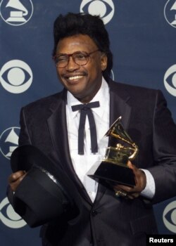 FILE - Singer Otis Rush poses with the Grammy Award he won for Best Traditional Blues Album for "Any Place I'm Going," Feb. 24, 1999, at the Grammy Awards in Los Angeles.