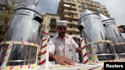 Waleed Ahmed el-Sayed, 31, who received a BA in social services from Assyiut University in 2004, sells juice in Cairo'sTahrir square, May 4, 2012. 