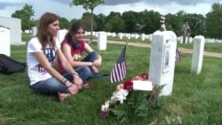 Soldiers Place US Flags in Arlington Cemetery for Memorial Day