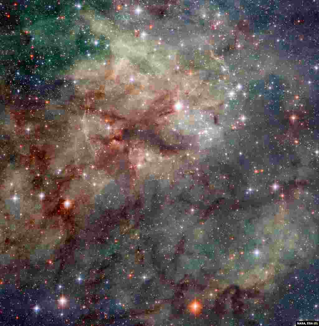 В Большом Магеллановом Облаке (так называется галактика-спутник нашего Млечного Пути) находится туманность &laquo;Тарантул&raquo;, которую мы и видим на этом снимке. Она известна своими обширными областями ионизированного водорода, где происходят процессы формирования звёзд.