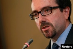 FILE - John Bass, U.S. ambassador to Turkey and formerly to Georgia, speaks during a news conference in Tbilisi, June 28, 2012.