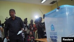 Joao Lourenco, presidential candidate for the ruling MPLA party, waits to cast his vote in Luanda, Angola, Aug. 23, 2017.