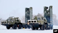 In this photo taken from video provided by the Russian Defense Ministry Press Service on Feb. 3, 2022, a view of Russian S-400 air defense missile systems in position during a military exercise, in Siberia.