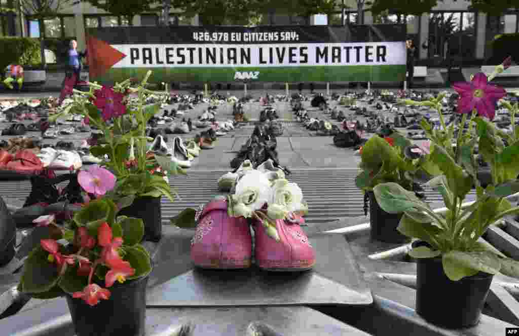 An installation of 4,500 shoes representing every life lost in the Israel-Palestine conflict since 2009 is displayed by a global civic organization Avaaz ahead of the EU Foreign ministers meeting in Brussels, Belgium.
