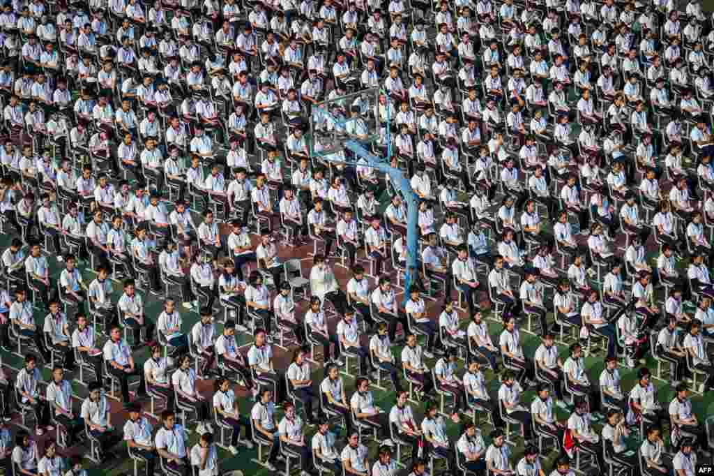 Students attend the 100th anniversary of the founding of Wuhan High School on the first day of the new semester in Wuhan in China&#39;s central Hubei province.