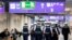 FILE - German police officers walk in a terminal at the airport in Frankfurt, Germany, March 23, 2016.