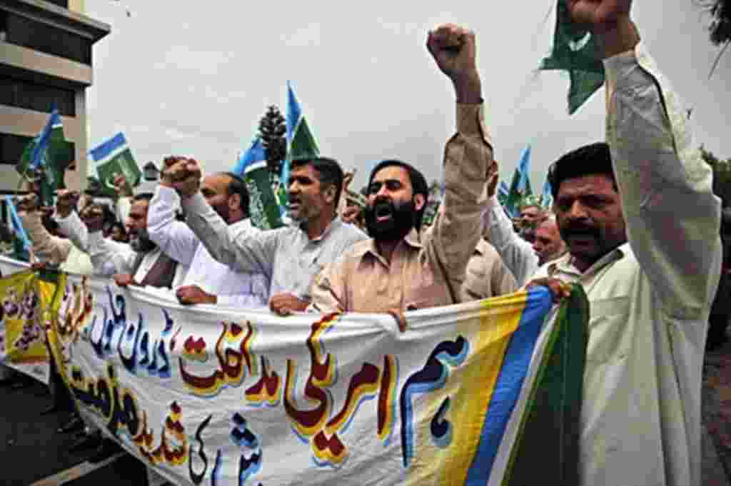 Activists of Jamaat-e-Islami Pakistan shout slogans as they march against the US President Barack Obama for eroding Pakistan's sovereignty with its operation to eliminate Osama bin Laden, in Rawalpindi on May 6, 2011. Hundreds of Pakistanis took to the st