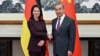 German Foreign Minister Annalena Baerbock, left, meets with Chinese counterpart Minister Wang Yi in Beijing, Dec. 2, 2024. 