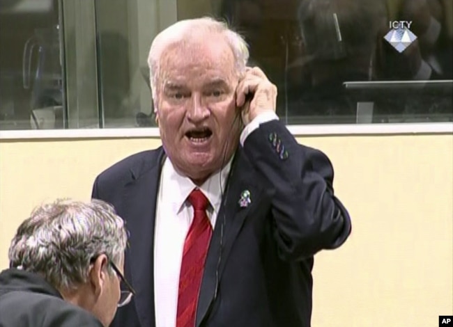 FILE - Former Bosnian Serb military commander Ratko Mladic is seen during an angry outburst at the Yugoslav War Crimes Tribunal in The Hague, Netherlands, Nov. 22, 2017.