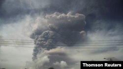 Ash and smoke billow as the La Soufriere volcano erupts in Kingstown on the eastern Caribbean island of St. Vincent, April 9, 2021.