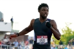 Noah Lyles competes in the U.S. Olympic Track and Field Trials, June 20, 2021, in Eugene, Ore. Lyles made a subtle gesture, wearing a black glove — minus the fingers on his left hand, and raising his fist when he was introduced.