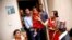 Nepal’s new living goddess Trishna Shakya, 3, is carried by her father as they leave home for a temple palace in Kathmandu, Nepal, Sept. 28, 2017.