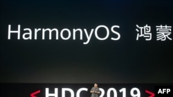 Richard Yu, head of Huawei's consumer business, unveils the company's new HarmonyOS operating system during a press conference in Dongguan, Guangdong province on Aug. 9, 2019.