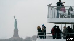  The Statue of Liberty and Ellis Island ferry transports passengers, Jan. 5, 2019, in New York, as the U.S. government shutdown enters its third week. New York state funds are being used to keep the attractions open during the shutdown, which has affected