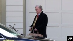 FILE - Former national security adviser John Bolton leaves his home in Bethesda, Maryland, Jan. 28, 2020.