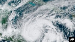 This GeoColor satellite image taken Monday, Nov. 2, 2020, at 1 p.m. EDT, and provided by NOAA, shows Hurricane Eta in the Gulf of Mexico approaching the border of Honduras and Nicaragua. 