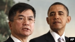 U.S. President Baracj Obama listens to Commerce Secretary Locke after he was announced as the new U.S. Ambassador to China, at the White House in Washington, March 9, 2011