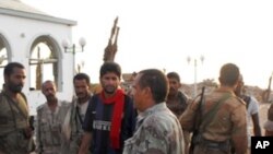 Yemen soldiers are seen in the southern city of Zinjibar, capital of Abyan province, on September 10, 2011, which was freed after being overrun by Al-Qaeda suspects in May.