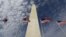 American flags fly below the Washington Monument. (AP Photo/Alex Brandon)