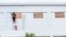 Workers board up the windows of a store in preparation for Hurricane Nana, expected as a Category 1 hurricane with winds up to 152 kph, in Belize City, Belize, on Sept. 2, 2020. 