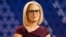 FILE - U.S. Rep. Kyrsten Sinema, D-Ariz., goes over the rules in a television studio prior to a televised debate with U.S. Rep. Martha McSally, R-Ariz., in Phoenix, Oct. 15, 2018.