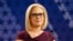 FILE - U.S. Rep. Kyrsten Sinema, D-Ariz., goes over the rules in a television studio prior to a televised debate with U.S. Rep. Martha McSally, R-Ariz., in Phoenix, Oct. 15, 2018.